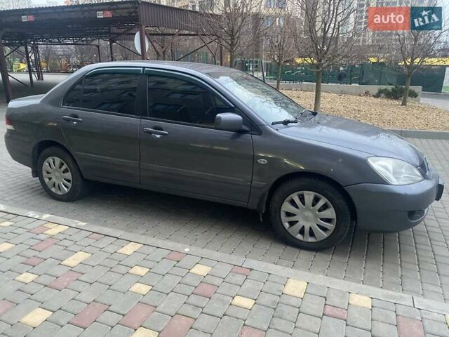 Сірий Міцубісі Lancer, об'ємом двигуна 1.6 л та пробігом 250 тис. км за 3500 $, фото 1 на Automoto.ua