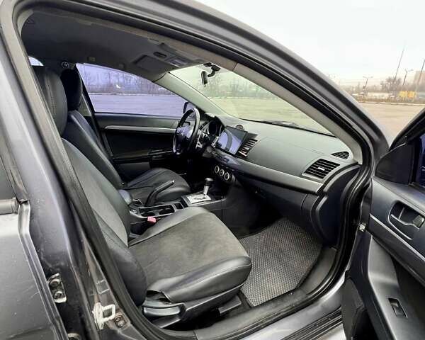 Серый Мицубиси Лансер, объемом двигателя 2 л и пробегом 203 тыс. км за 4999 $, фото 10 на Automoto.ua