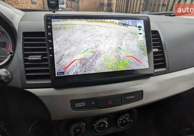 Серый Мицубиси Лансер, объемом двигателя 1.5 л и пробегом 147 тыс. км за 6700 $, фото 20 на Automoto.ua