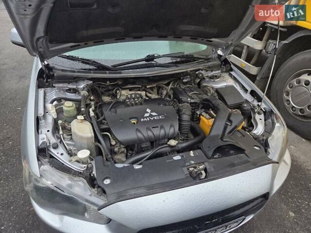 Серый Мицубиси Лансер, объемом двигателя 2 л и пробегом 175 тыс. км за 6500 $, фото 9 на Automoto.ua