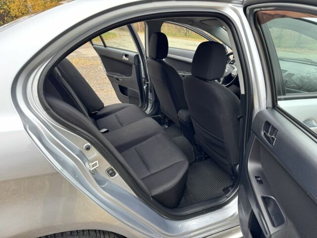 Серый Мицубиси Лансер, объемом двигателя 2 л и пробегом 225 тыс. км за 6890 $, фото 13 на Automoto.ua