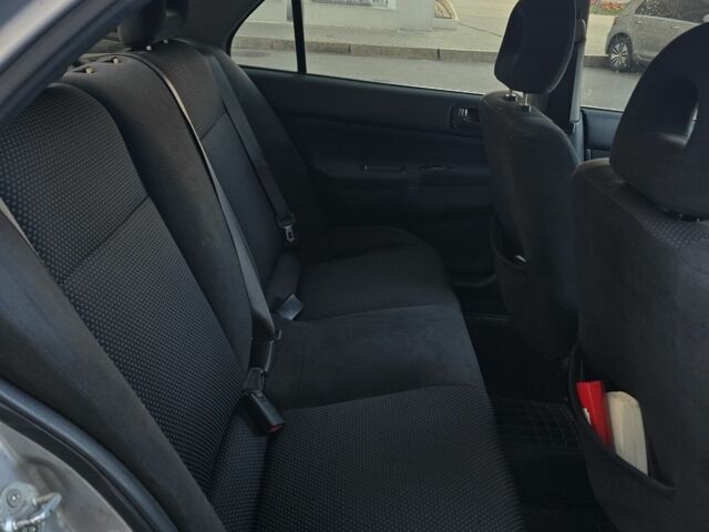 Серый Мицубиси Лансер, объемом двигателя 1.6 л и пробегом 150 тыс. км за 4700 $, фото 5 на Automoto.ua