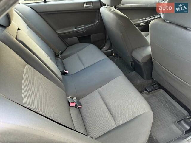 Серый Мицубиси Лансер, объемом двигателя 2 л и пробегом 230 тыс. км за 6900 $, фото 28 на Automoto.ua