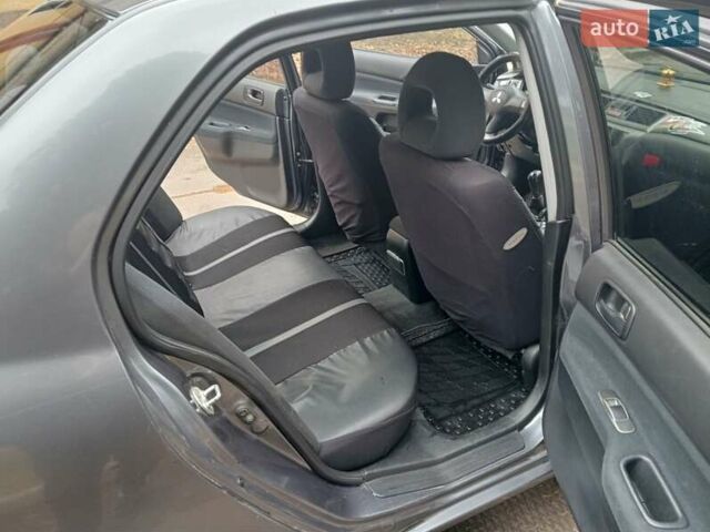 Серый Мицубиси Лансер, объемом двигателя 1.58 л и пробегом 205 тыс. км за 3300 $, фото 10 на Automoto.ua