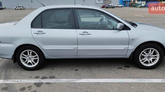 Серый Мицубиси Лансер, объемом двигателя 1.58 л и пробегом 216 тыс. км за 4700 $, фото 9 на Automoto.ua