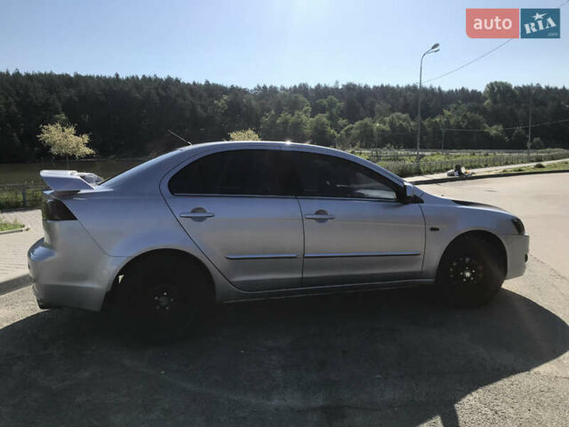 Серый Мицубиси Лансер, объемом двигателя 2 л и пробегом 256 тыс. км за 7000 $, фото 3 на Automoto.ua