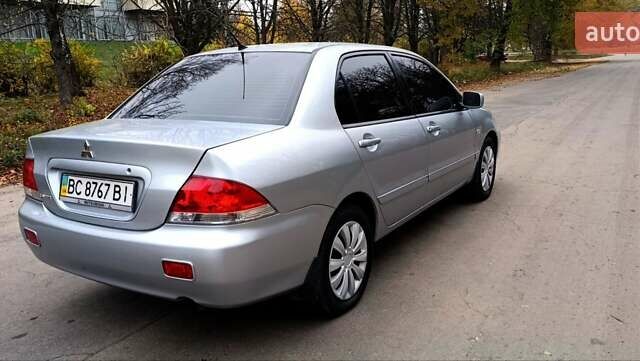 Серый Мицубиси Лансер, объемом двигателя 1.58 л и пробегом 176 тыс. км за 5000 $, фото 5 на Automoto.ua