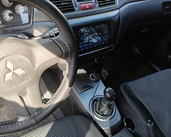 Сірий Міцубісі Lancer, об'ємом двигуна 1.58 л та пробігом 97 тис. км за 6800 $, фото 6 на Automoto.ua