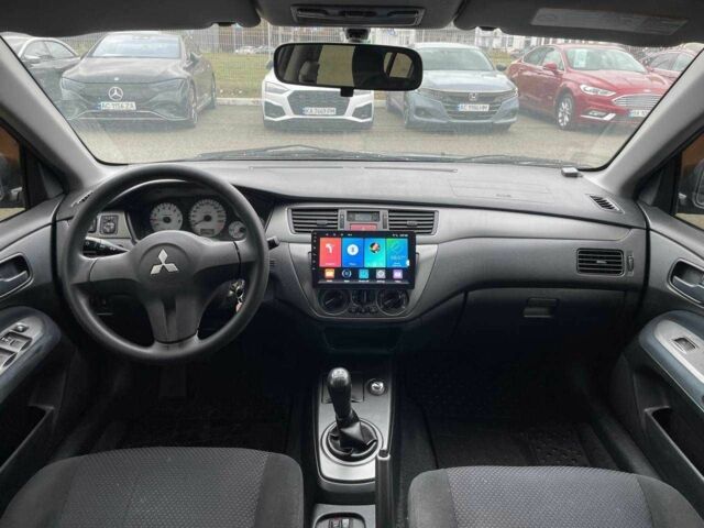 Серый Мицубиси Лансер, объемом двигателя 1.6 л и пробегом 146 тыс. км за 5990 $, фото 11 на Automoto.ua