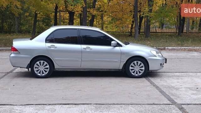 Сірий Міцубісі Lancer, об'ємом двигуна 1.6 л та пробігом 176 тис. км за 4999 $, фото 14 на Automoto.ua