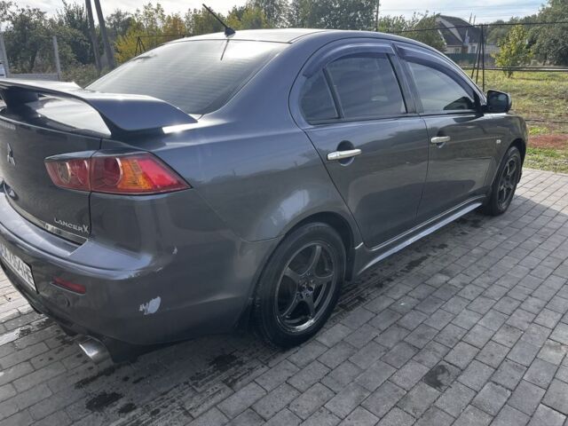 Серый Мицубиси Лансер, объемом двигателя 2 л и пробегом 224 тыс. км за 6500 $, фото 3 на Automoto.ua