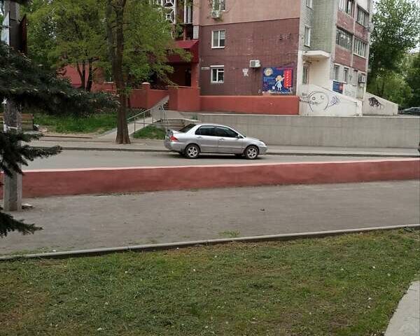 Серый Мицубиси Лансер, объемом двигателя 1.6 л и пробегом 244 тыс. км за 5250 $, фото 6 на Automoto.ua