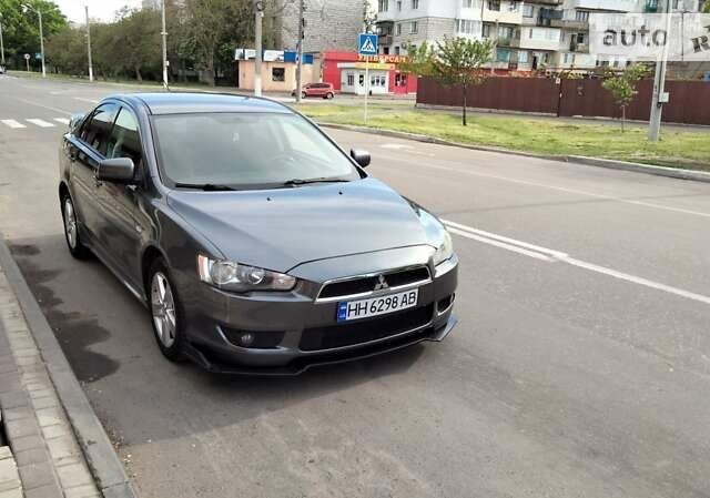 Сірий Міцубісі Lancer, об'ємом двигуна 2 л та пробігом 221 тис. км за 7100 $, фото 44 на Automoto.ua