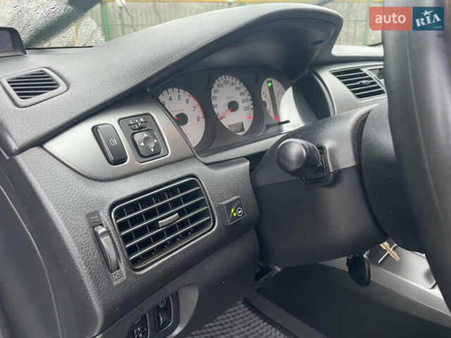 Сірий Міцубісі Lancer, об'ємом двигуна 1.58 л та пробігом 220 тис. км за 5900 $, фото 19 на Automoto.ua