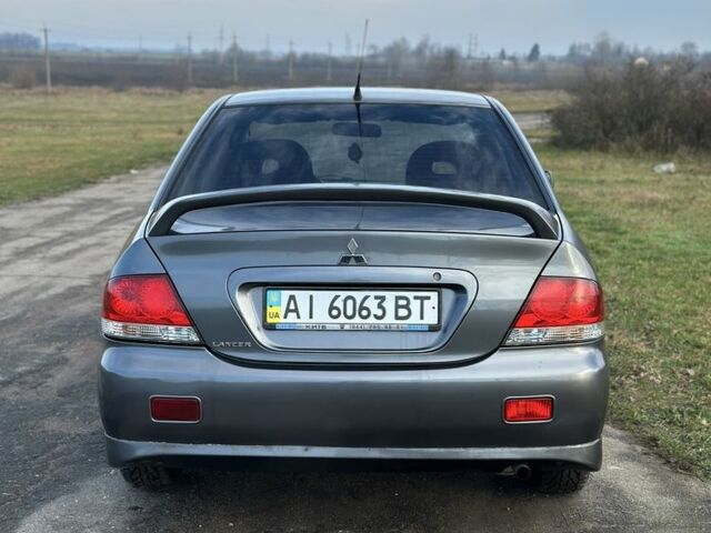 Серый Мицубиси Лансер, объемом двигателя 1.6 л и пробегом 114 тыс. км за 4000 $, фото 4 на Automoto.ua