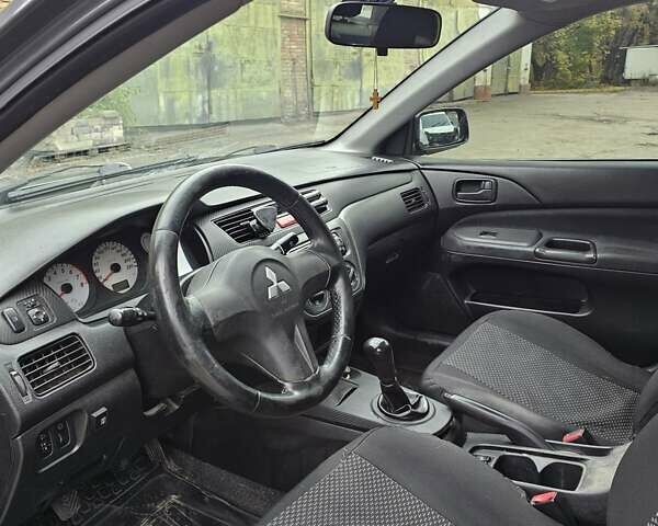 Сірий Міцубісі Lancer, об'ємом двигуна 1.58 л та пробігом 200 тис. км за 1700 $, фото 12 на Automoto.ua