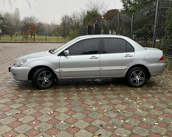 Сірий Міцубісі Lancer, об'ємом двигуна 1.59 л та пробігом 219 тис. км за 4500 $, фото 8 на Automoto.ua