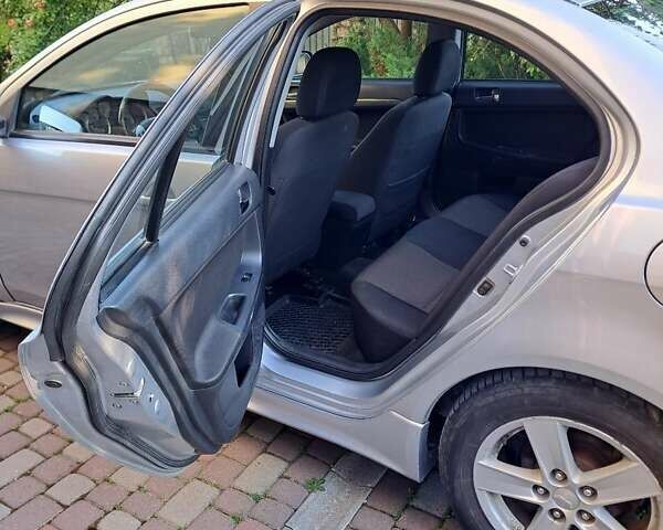 Сірий Міцубісі Lancer, об'ємом двигуна 2 л та пробігом 207 тис. км за 6550 $, фото 5 на Automoto.ua
