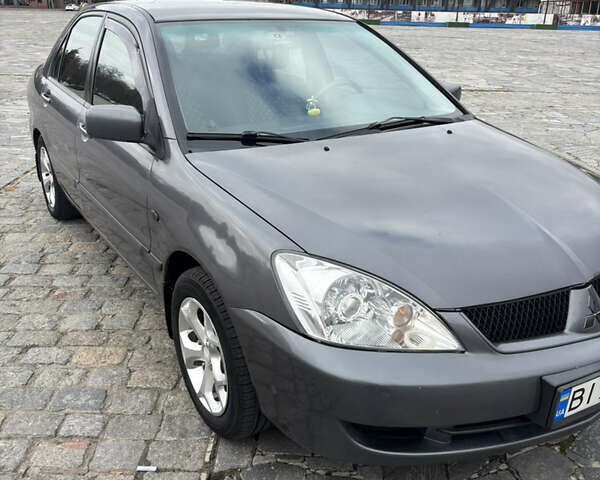 Серый Мицубиси Лансер, объемом двигателя 1.6 л и пробегом 222 тыс. км за 5200 $, фото 1 на Automoto.ua