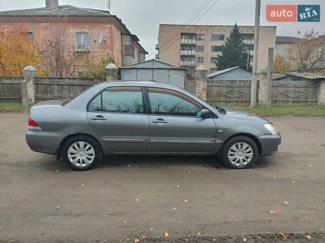 Сірий Міцубісі Lancer, об'ємом двигуна 1.58 л та пробігом 1 тис. км за 2850 $, фото 6 на Automoto.ua