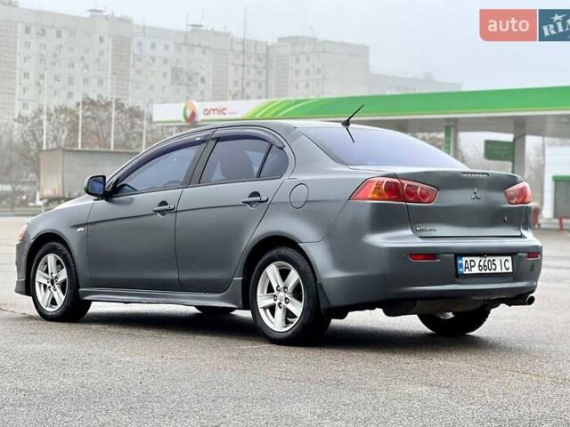 Серый Мицубиси Лансер, объемом двигателя 2 л и пробегом 203 тыс. км за 4999 $, фото 4 на Automoto.ua