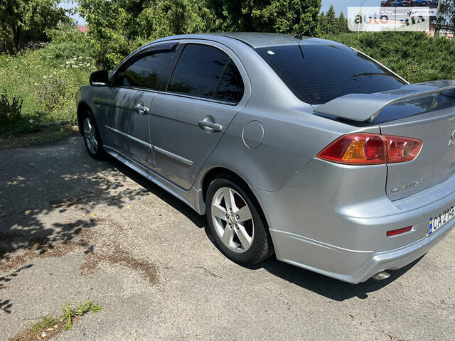 Сірий Міцубісі Lancer, об'ємом двигуна 2 л та пробігом 306 тис. км за 6300 $, фото 5 на Automoto.ua