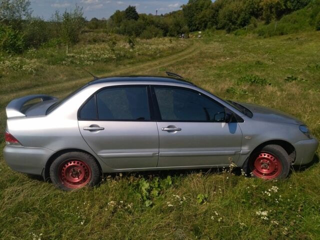 Серый Мицубиси Лансер, объемом двигателя 1.6 л и пробегом 350 тыс. км за 3600 $, фото 1 на Automoto.ua