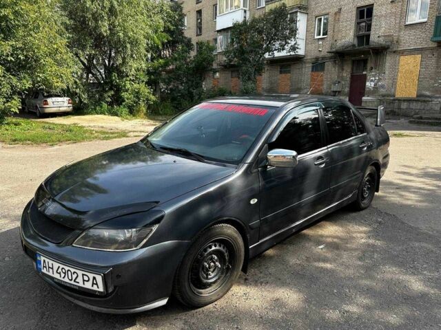 Серый Мицубиси Лансер, объемом двигателя 1.6 л и пробегом 999 тыс. км за 3200 $, фото 1 на Automoto.ua