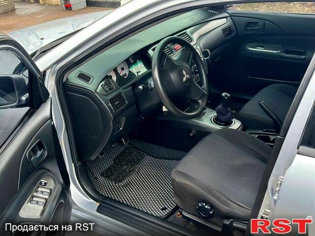 Серый Мицубиси Лансер, объемом двигателя 1.6 л и пробегом 165 тыс. км за 4000 $, фото 4 на Automoto.ua