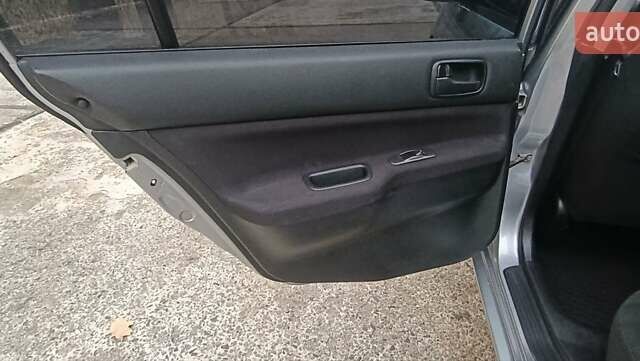 Сірий Міцубісі Lancer, об'ємом двигуна 1.6 л та пробігом 176 тис. км за 4999 $, фото 29 на Automoto.ua