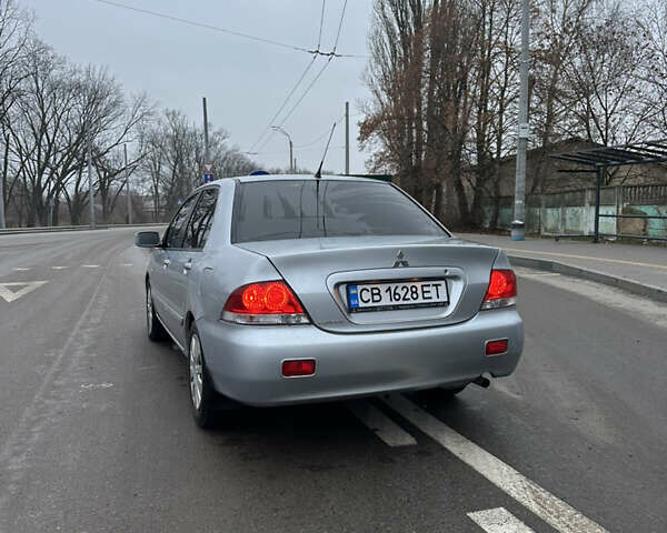 Сірий Міцубісі Lancer, об'ємом двигуна 1.58 л та пробігом 180 тис. км за 3900 $, фото 1 на Automoto.ua