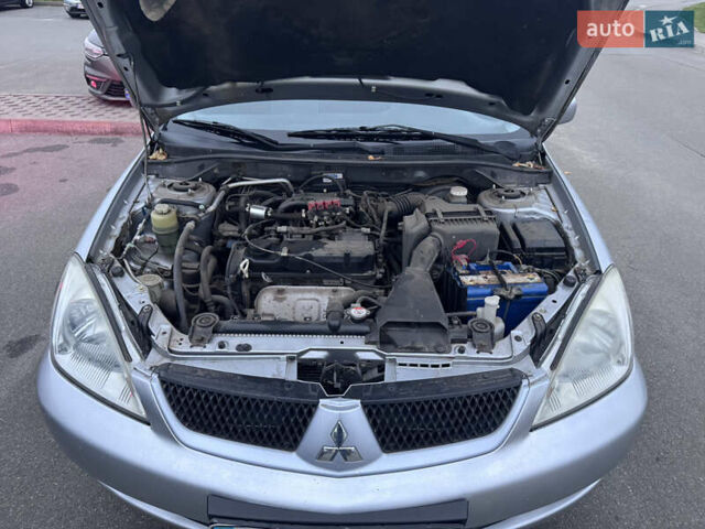 Серый Мицубиси Лансер, объемом двигателя 1.58 л и пробегом 330 тыс. км за 3500 $, фото 5 на Automoto.ua