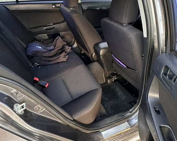 Серый Мицубиси Лансер, объемом двигателя 1.5 л и пробегом 255 тыс. км за 6000 $, фото 13 на Automoto.ua