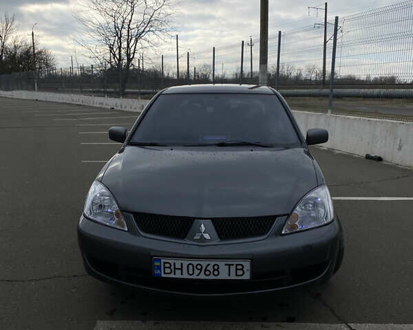 Сірий Міцубісі Lancer, об'ємом двигуна 1.58 л та пробігом 293 тис. км за 4350 $, фото 1 на Automoto.ua