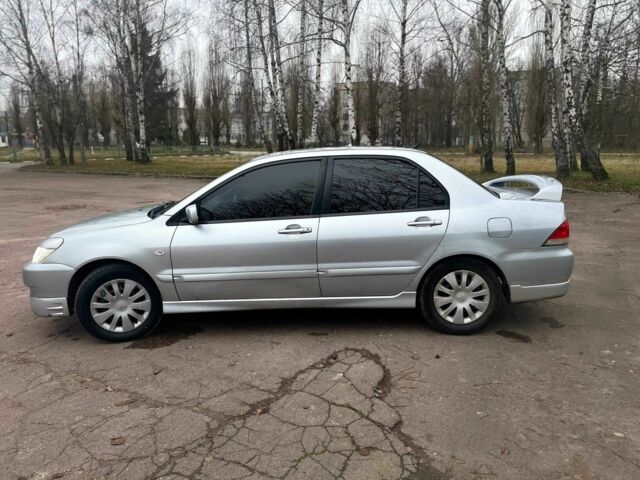Сірий Міцубісі Lancer, об'ємом двигуна 1.6 л та пробігом 254 тис. км за 3800 $, фото 7 на Automoto.ua