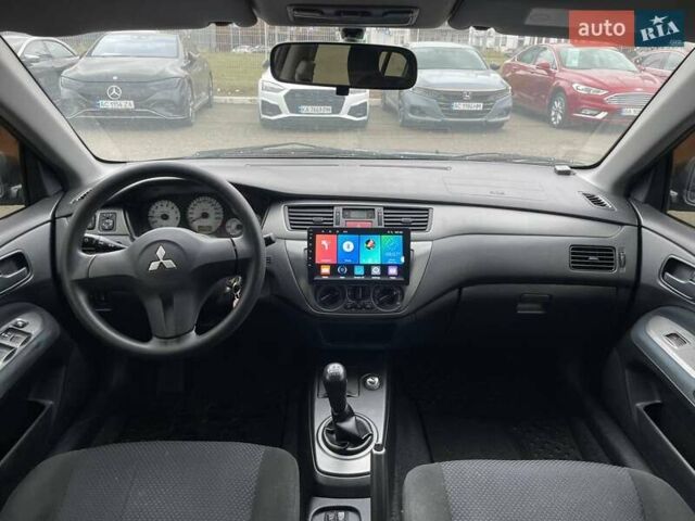 Серый Мицубиси Лансер, объемом двигателя 1.58 л и пробегом 146 тыс. км за 5490 $, фото 12 на Automoto.ua