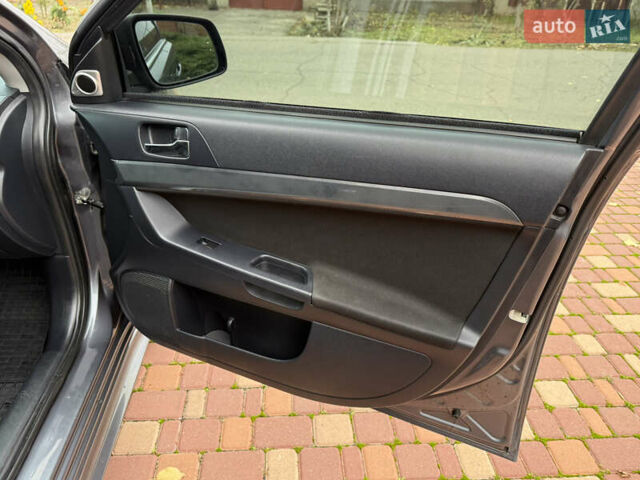 Сірий Міцубісі Lancer, об'ємом двигуна 2 л та пробігом 92 тис. км за 8200 $, фото 29 на Automoto.ua