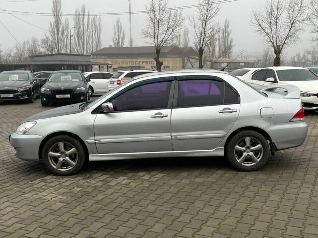 Серый Мицубиси Лансер, объемом двигателя 1.6 л и пробегом 205 тыс. км за 5400 $, фото 3 на Automoto.ua