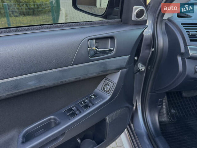 Сірий Міцубісі Lancer, об'ємом двигуна 2 л та пробігом 92 тис. км за 9800 $, фото 85 на Automoto.ua