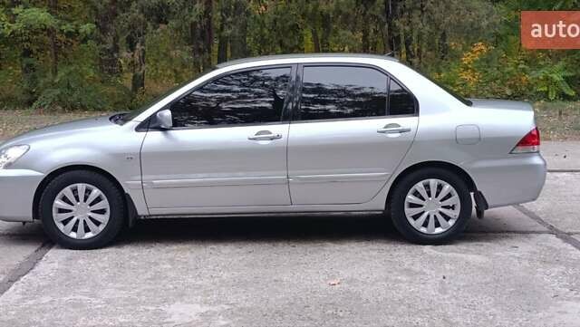 Сірий Міцубісі Lancer, об'ємом двигуна 1.6 л та пробігом 176 тис. км за 4999 $, фото 12 на Automoto.ua