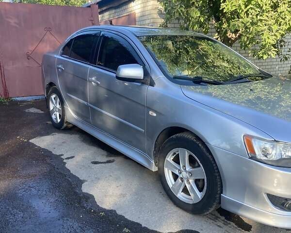 Серый Мицубиси Лансер, объемом двигателя 2 л и пробегом 266 тыс. км за 7000 $, фото 13 на Automoto.ua