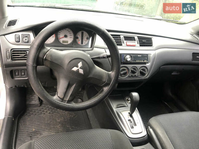 Сірий Міцубісі Lancer, об'ємом двигуна 1.58 л та пробігом 240 тис. км за 4299 $, фото 15 на Automoto.ua