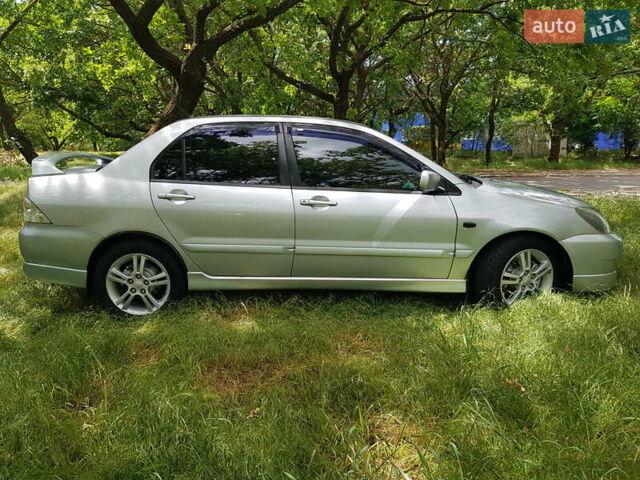 Серый Мицубиси Лансер, объемом двигателя 2 л и пробегом 150 тыс. км за 5650 $, фото 4 на Automoto.ua