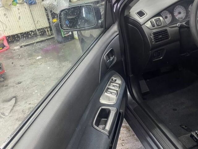 Серый Мицубиси Лансер, объемом двигателя 1.6 л и пробегом 100 тыс. км за 2500 $, фото 10 на Automoto.ua