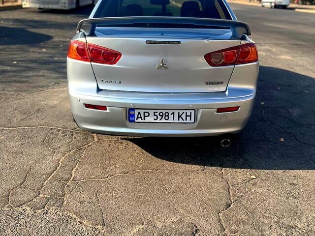 Серый Мицубиси Лансер, объемом двигателя 2 л и пробегом 151 тыс. км за 6099 $, фото 3 на Automoto.ua