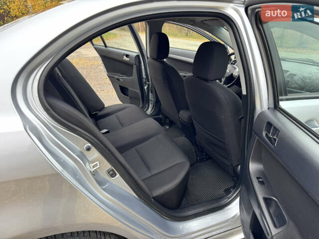 Сірий Міцубісі Lancer, об'ємом двигуна 2 л та пробігом 225 тис. км за 6890 $, фото 13 на Automoto.ua