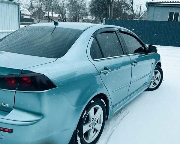 Сірий Міцубісі Lancer, об'ємом двигуна 2 л та пробігом 213 тис. км за 7300 $, фото 6 на Automoto.ua