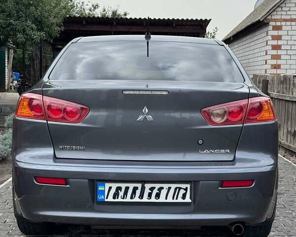 Сірий Міцубісі Lancer, об'ємом двигуна 2 л та пробігом 170 тис. км за 8200 $, фото 4 на Automoto.ua