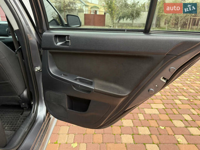 Сірий Міцубісі Lancer, об'ємом двигуна 2 л та пробігом 92 тис. км за 8200 $, фото 28 на Automoto.ua