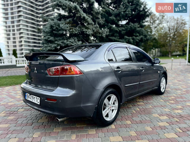 Серый Мицубиси Лансер, объемом двигателя 2 л и пробегом 212 тыс. км за 6000 $, фото 11 на Automoto.ua